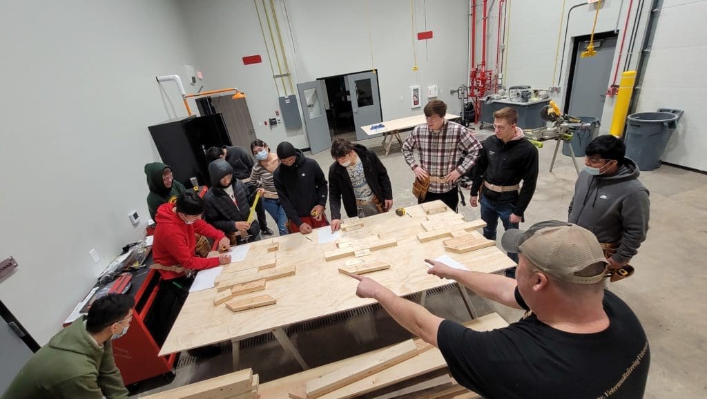 WMCI Instructor Shawn Moulenbelt teaches high school students about elements of carpentry