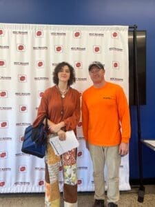 WMCI high school student Billie Beresford is receiving their certificate upon graduating from Carpentry I.